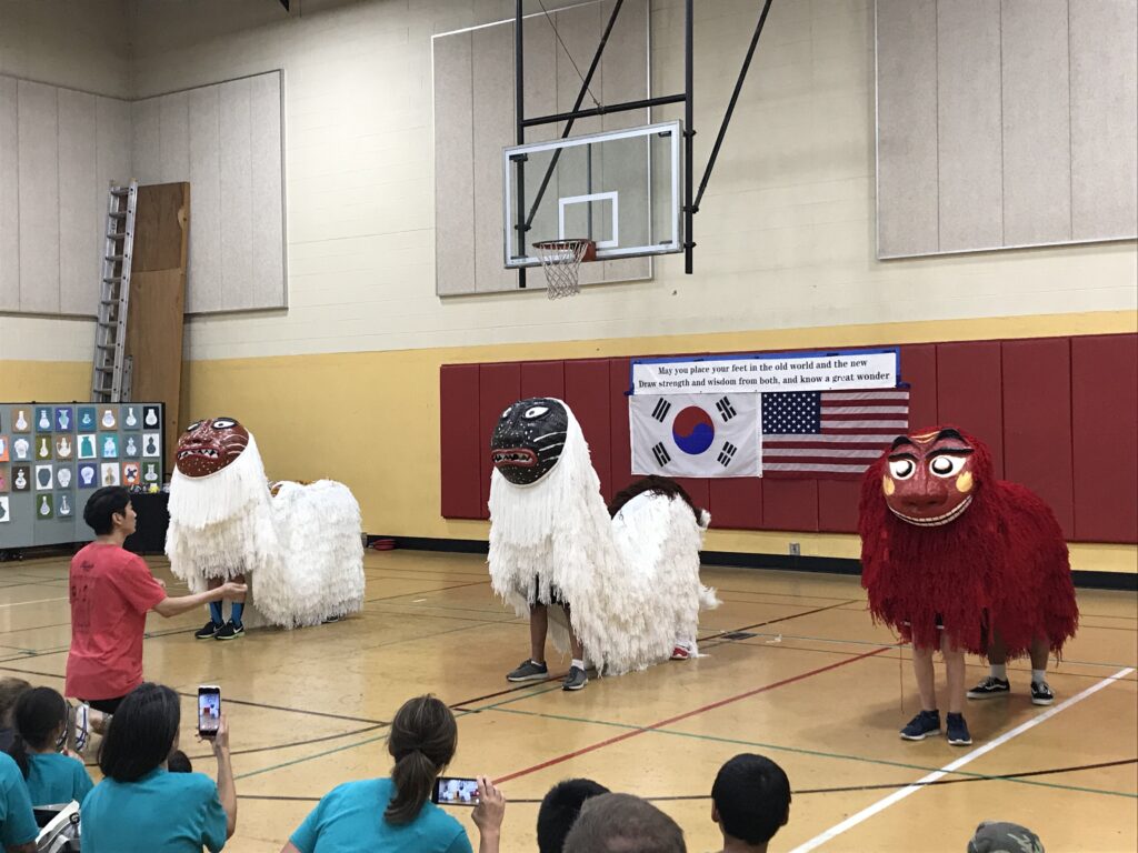Three dragon costumes dancing.